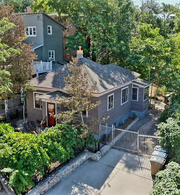 View of front of house with roof with shingles