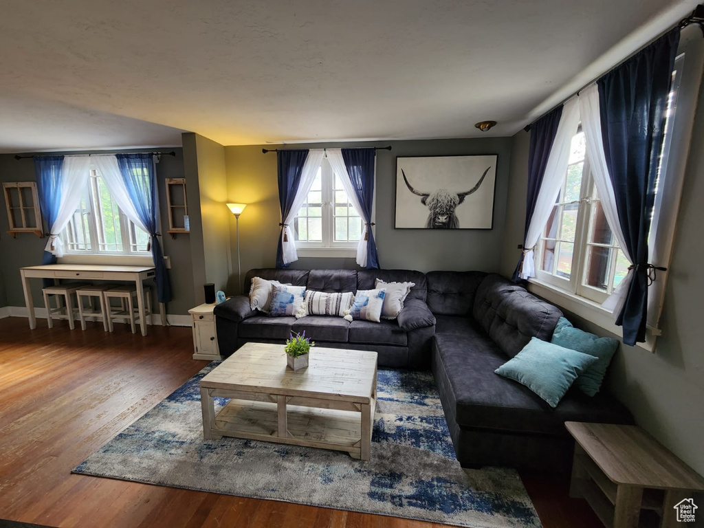 Living room with wood finished floors and baseboards
