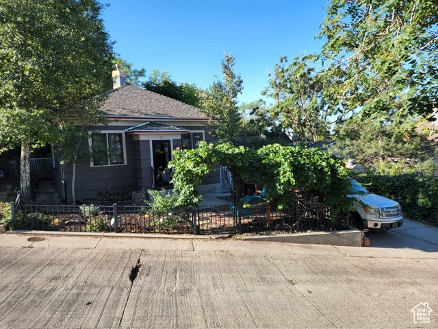 Obstructed view of property with a chimney