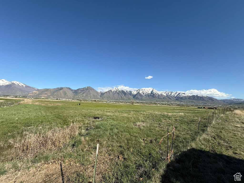 View of mountain backdrop with rural landscape