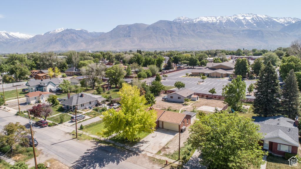 Aerial perspective of suburban area with a mountainous background