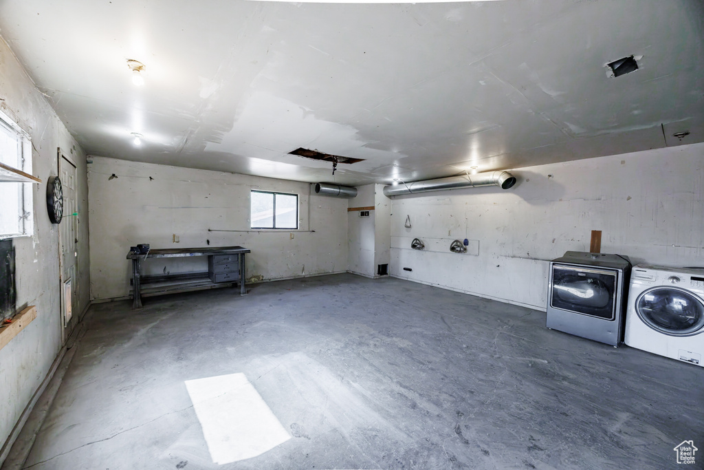 Garage featuring washing machine and clothes dryer