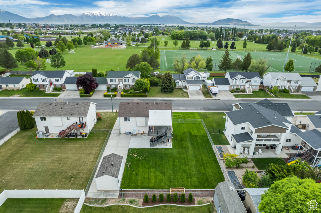 Aerial perspective of suburban area featuring a mountainous background
