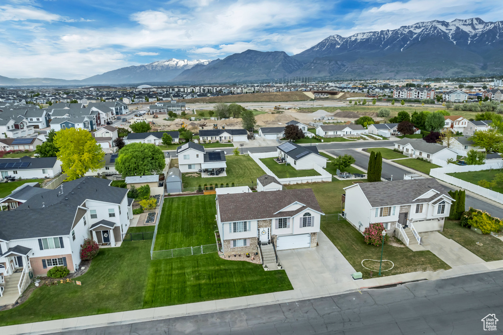 Aerial perspective of suburban area with a mountain backdrop