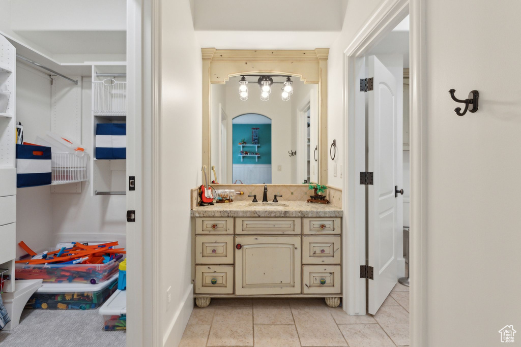 Bathroom featuring vanity and tile patterned floors