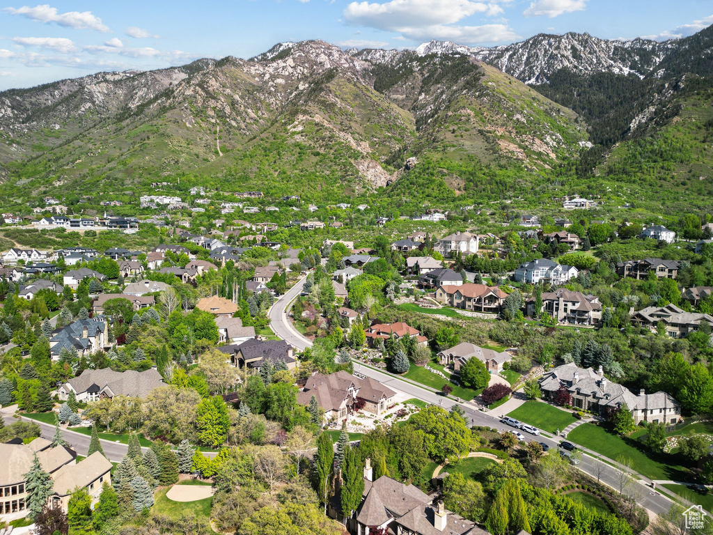 Aerial overview of property\\\'s location with mountains and nearby suburban area