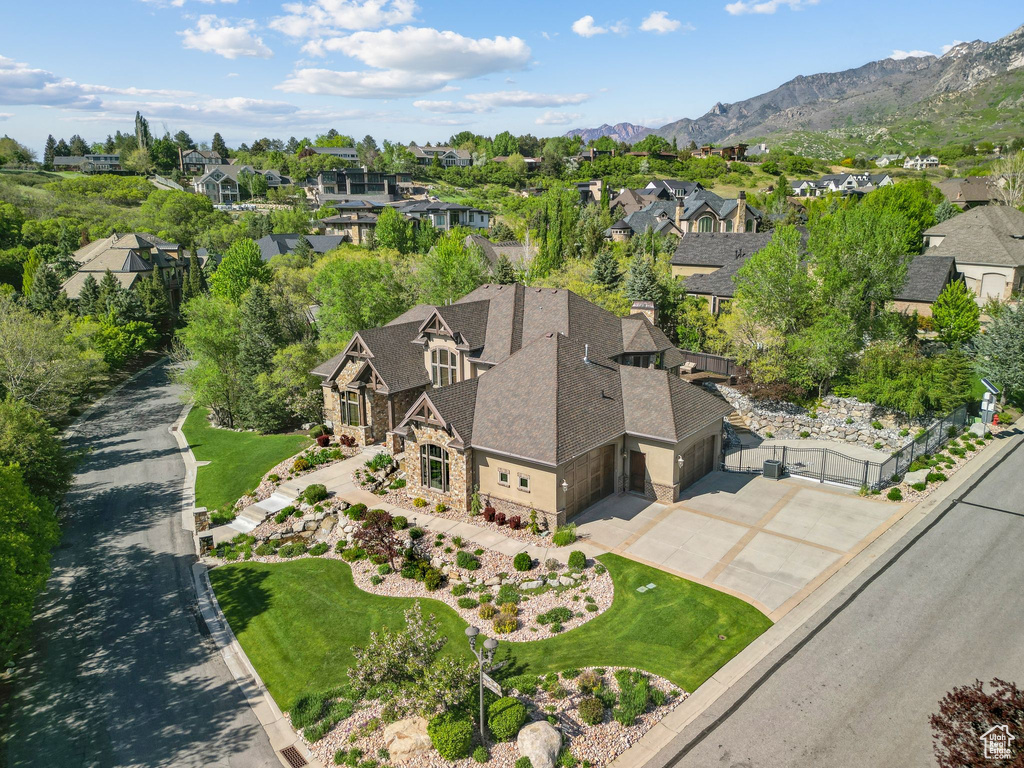 Aerial view of residential area featuring a mountain backdrop