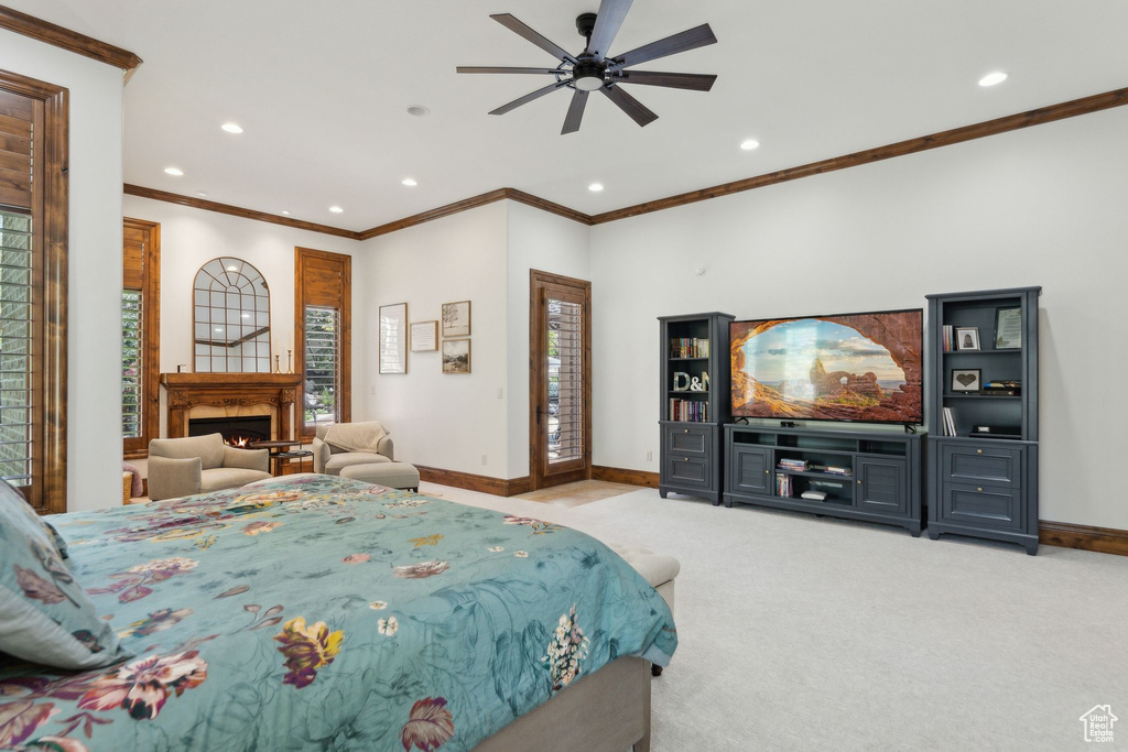 Bedroom featuring baseboards, recessed lighting, carpet floors, ornamental molding, and access to exterior