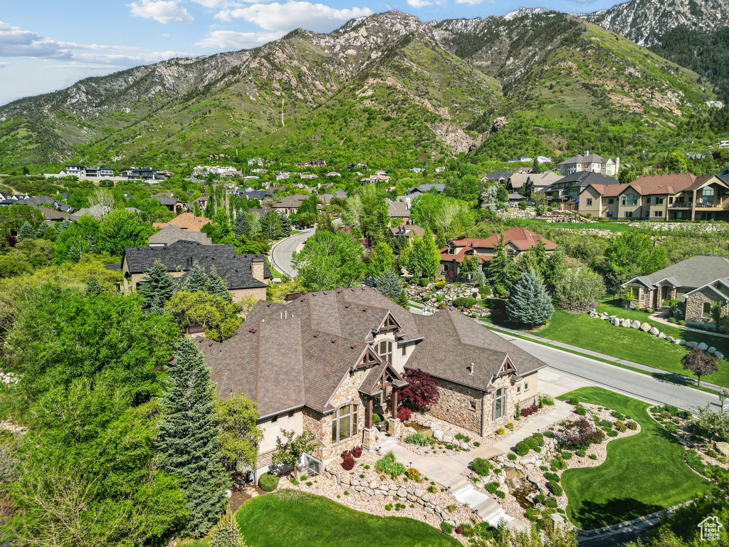 Aerial view of residential area featuring a mountainous background