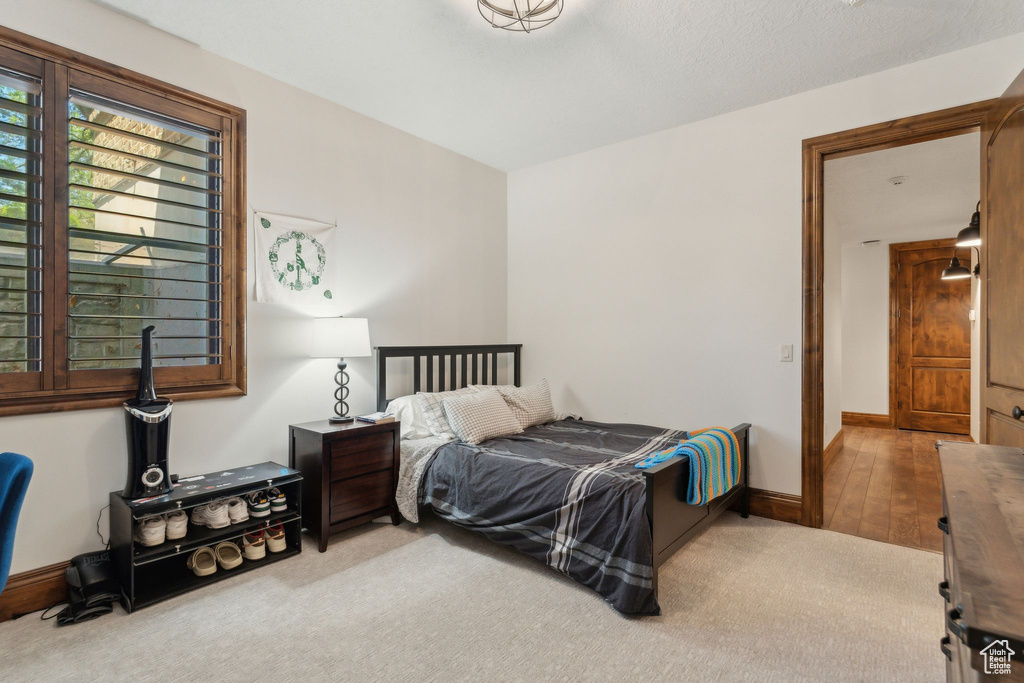 Carpeted bedroom with baseboards