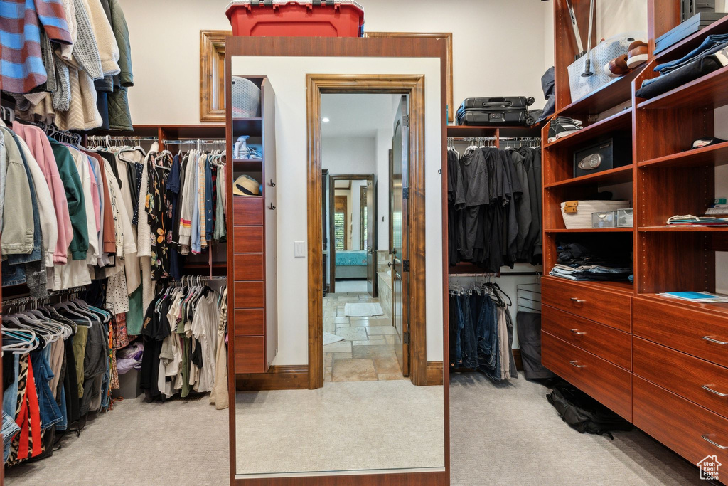 Walk in closet with carpet
