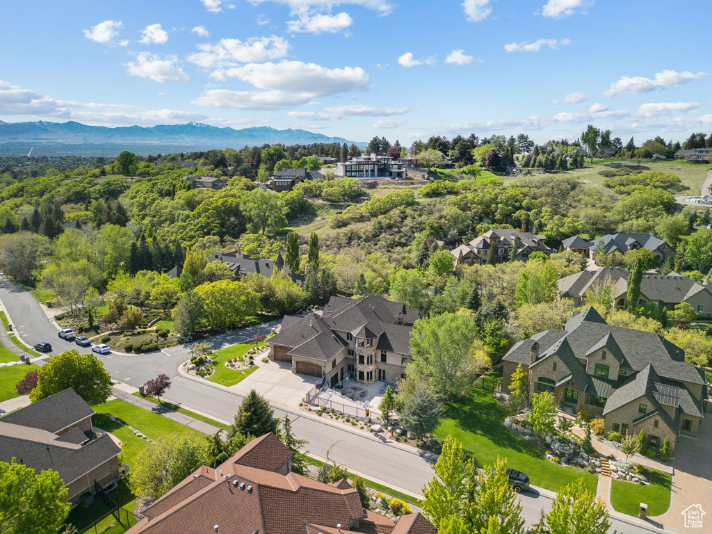 Aerial view of residential area featuring a mountain backdrop