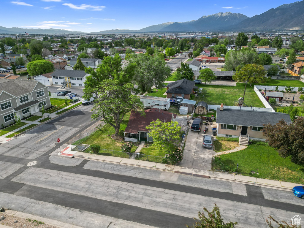 Aerial view of residential area featuring a mountainous background