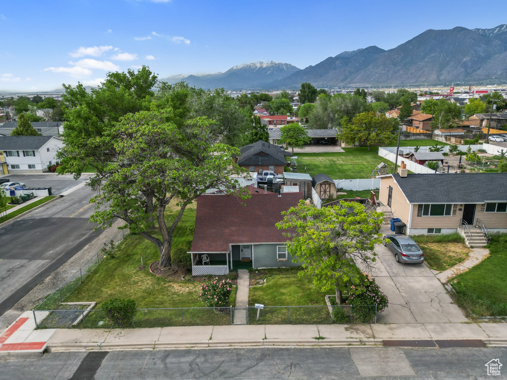 Aerial perspective of suburban area featuring a mountainous background