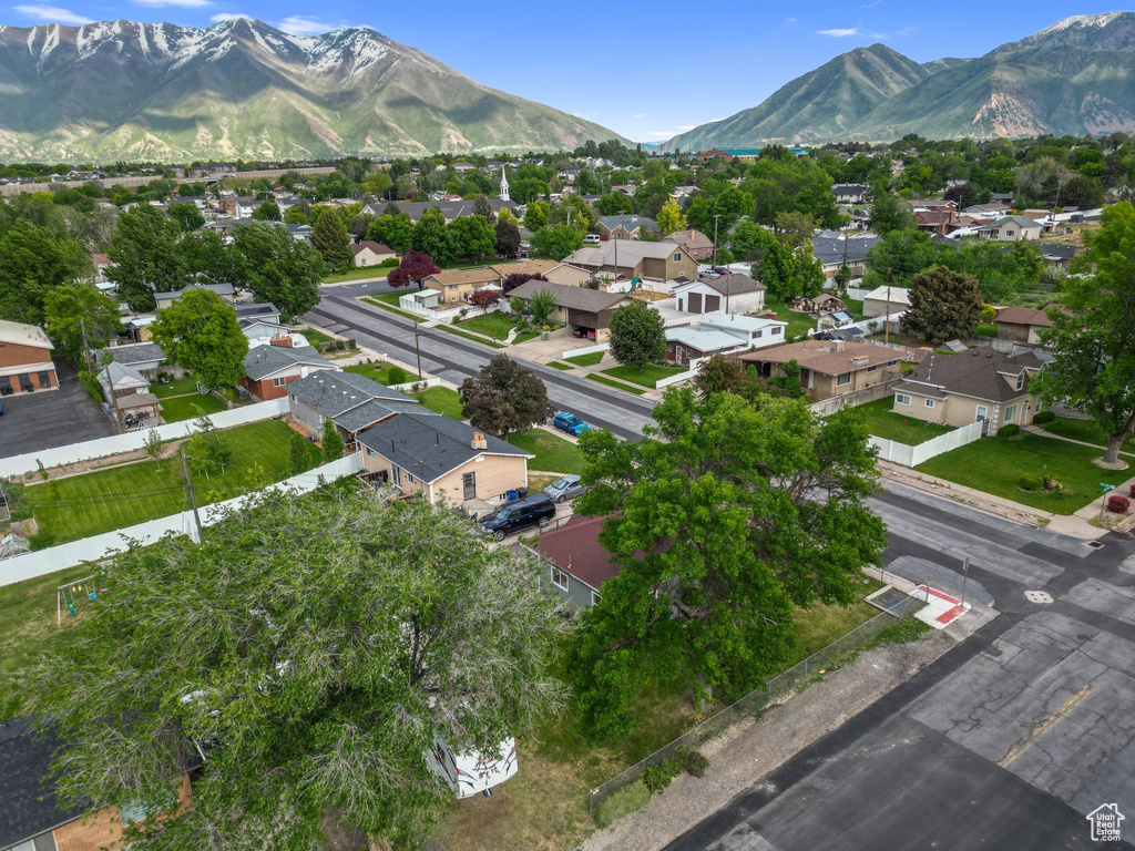 Aerial perspective of suburban area with a mountain backdrop