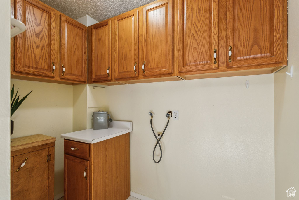 Laundry area with cabinet space and washer hookup