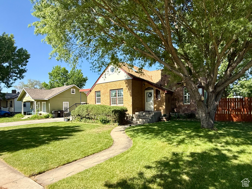 View of front of home featuring brick siding