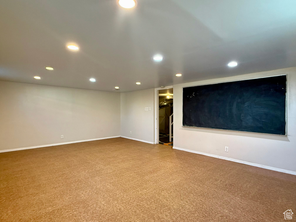 Spare room featuring recessed lighting and baseboards
