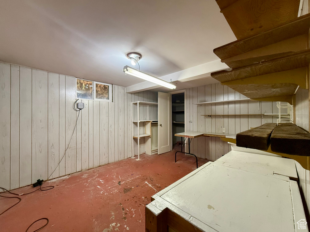 Miscellaneous room with wooden walls