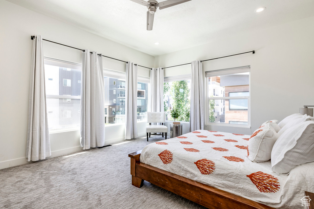 Bedroom with carpet, baseboards, ceiling fan, and recessed lighting
