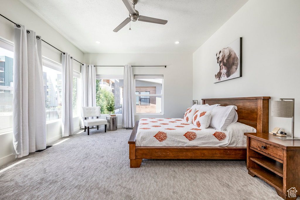 Bedroom with carpet flooring, ceiling fan, and recessed lighting