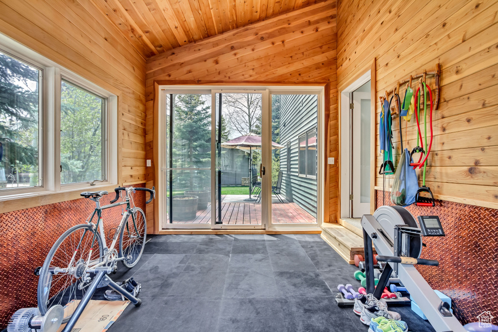 Exercise room featuring wooden walls