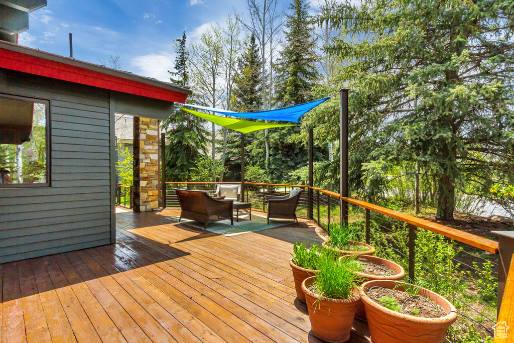 Wooden terrace with an outdoor living space