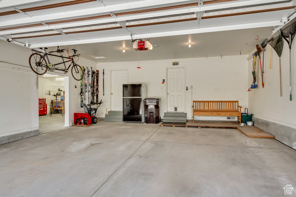 Garage featuring a garage door opener