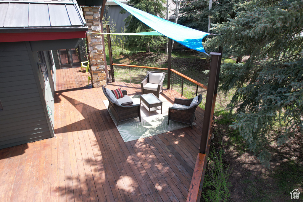 Deck featuring outdoor lounge area