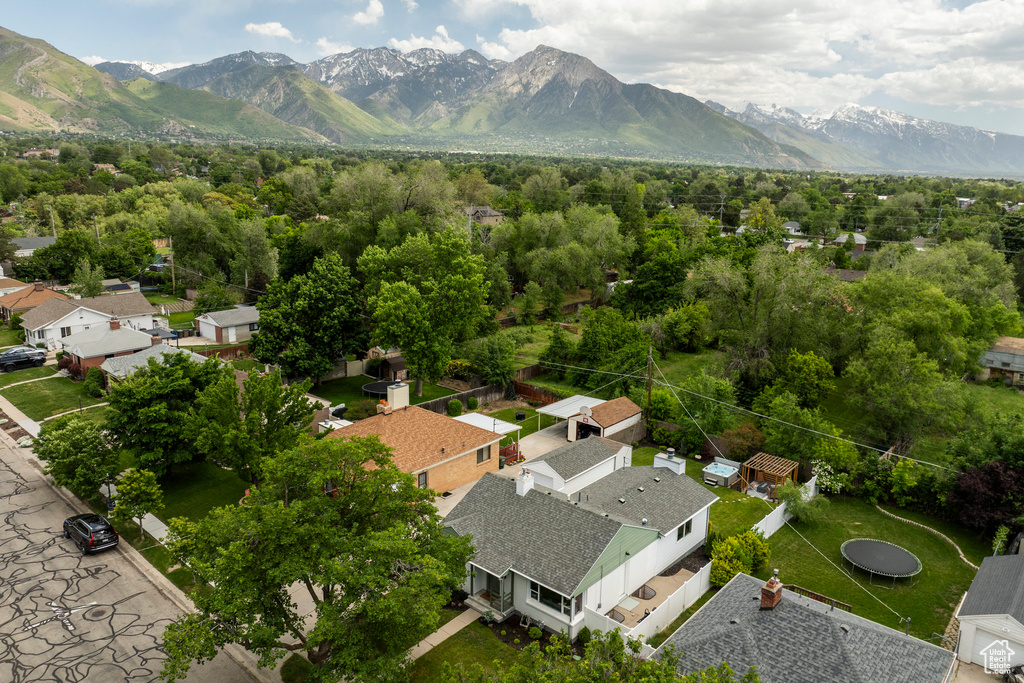 Aerial view of residential area featuring a mountainous background