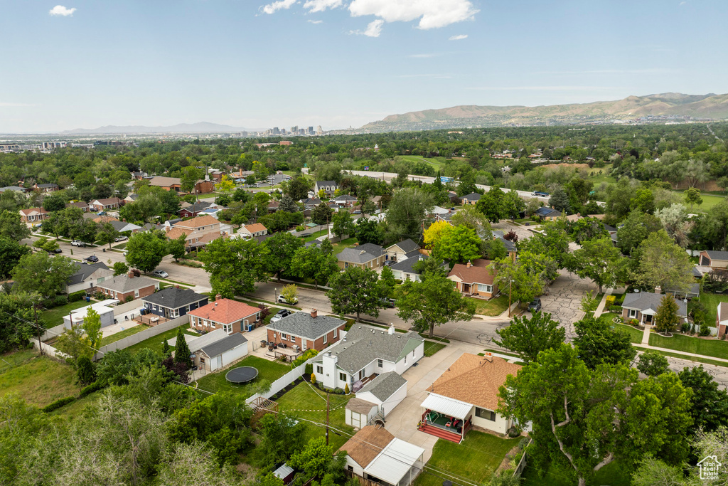Aerial perspective of suburban area featuring a mountain backdrop