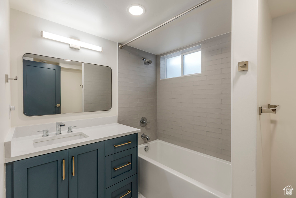 Bathroom with vanity and  shower combination