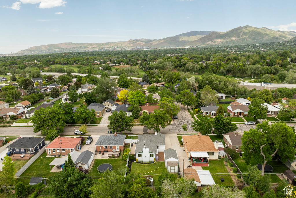 Aerial perspective of suburban area featuring a mountain backdrop