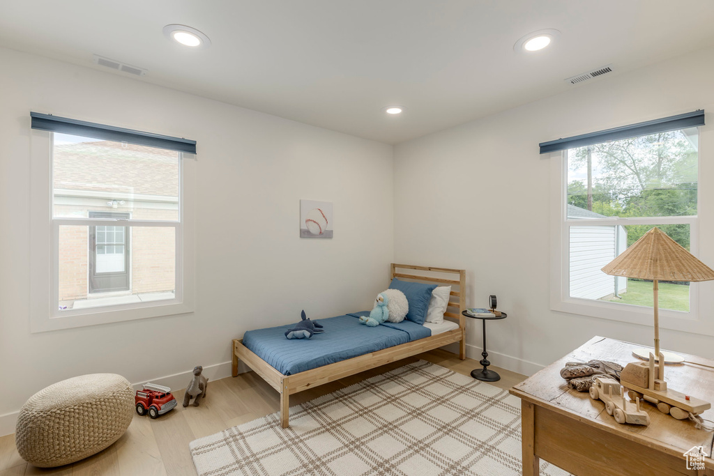 Bedroom featuring recessed lighting, light wood-style flooring, and baseboards