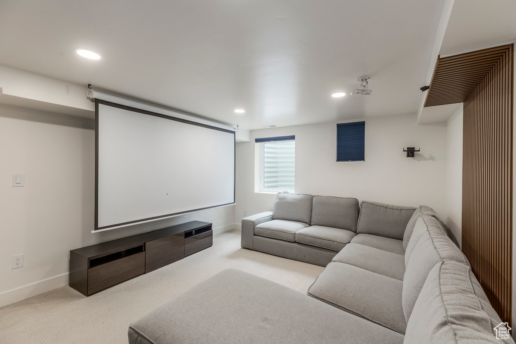 Carpeted cinema room featuring recessed lighting and baseboards