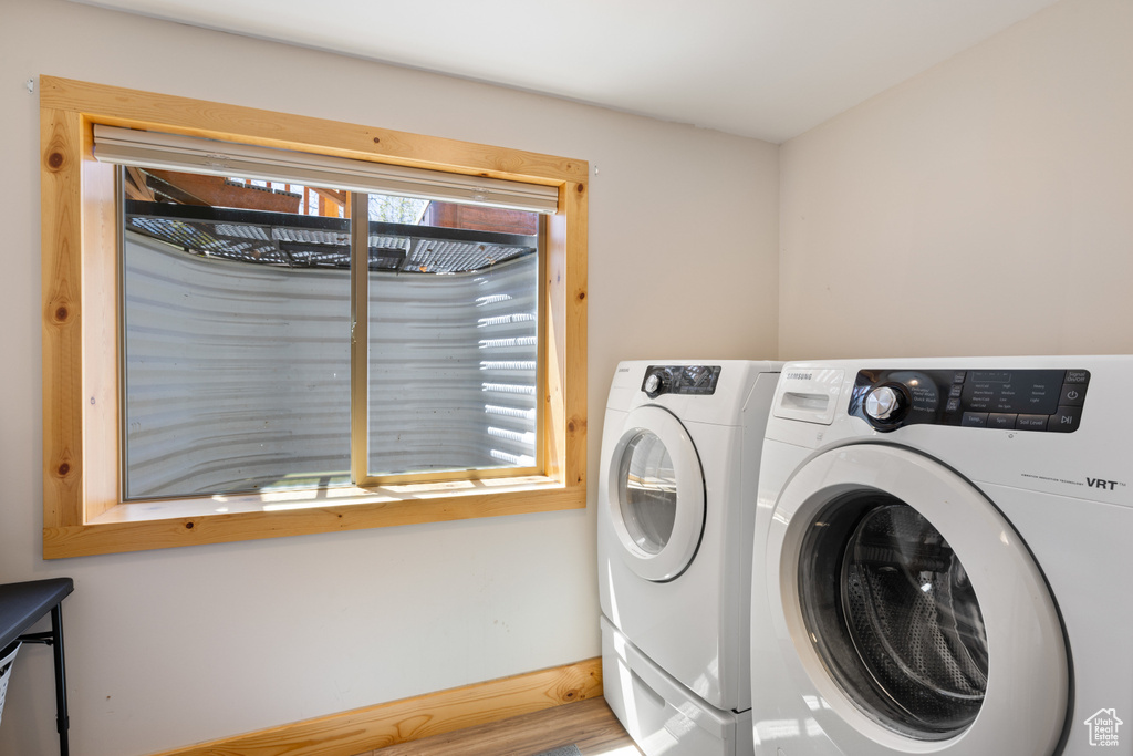 Washroom with washing machine and clothes dryer