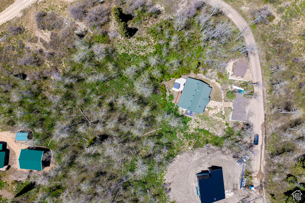 Aerial view of property and surrounding area featuring a pool
