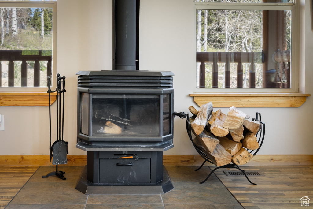 Detailed view of a wood stove and baseboards