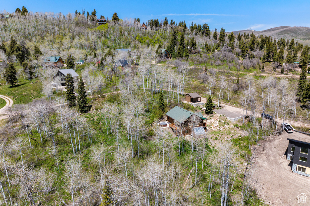 View of subject property featuring a mountainous background