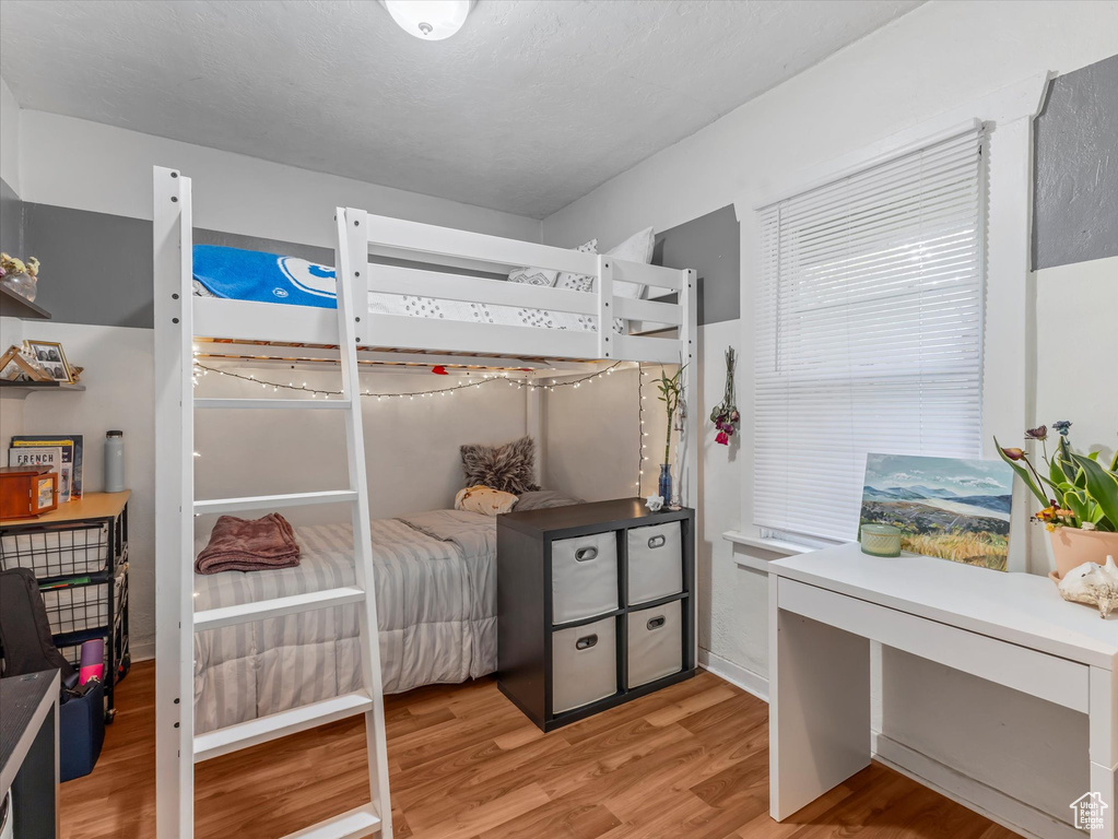 Bedroom featuring light wood-type flooring