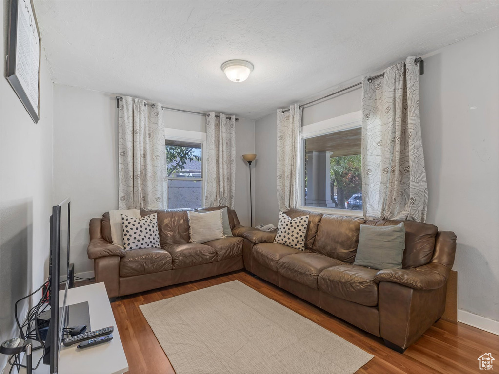 Living area featuring wood finished floors and baseboards