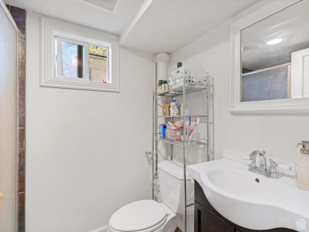 Bathroom featuring toilet and vanity