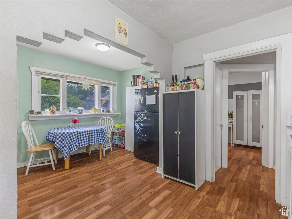 Dining space with wood finished floors