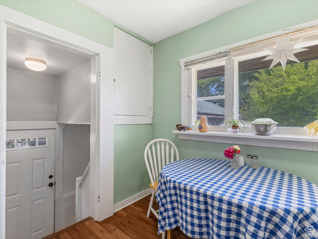 Bedroom featuring wood finished floors and baseboards