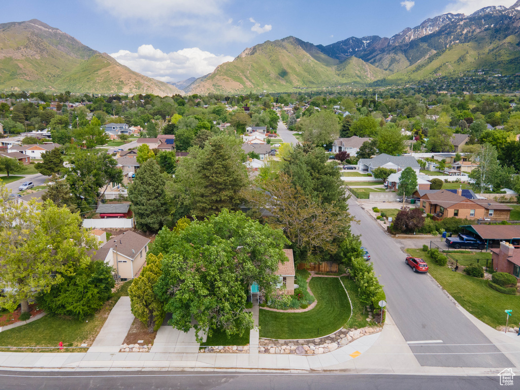 Aerial perspective of suburban area with a mountainous background