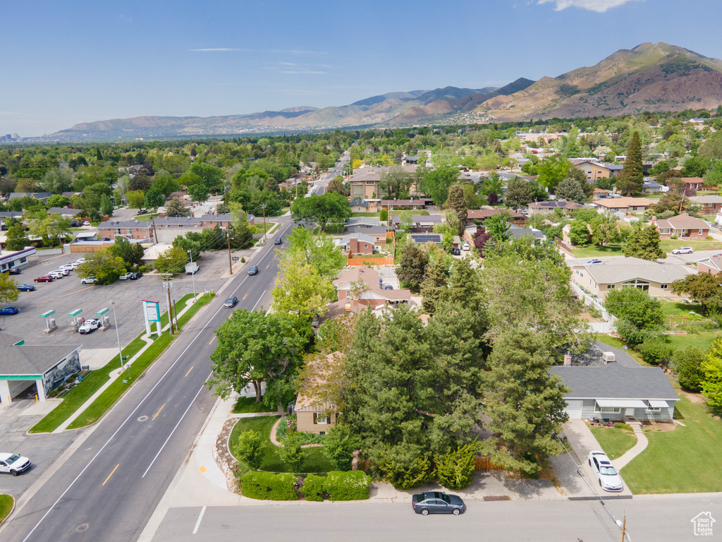 Aerial perspective of suburban area with a mountainous background
