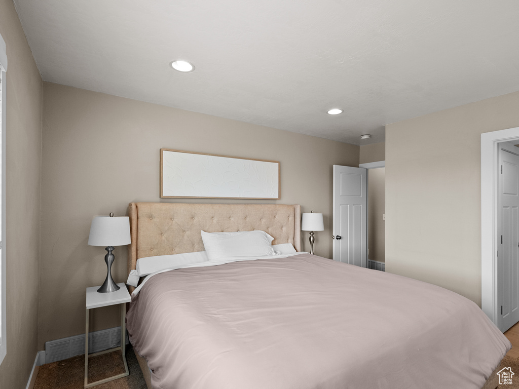 Bedroom with baseboards, carpet, and recessed lighting