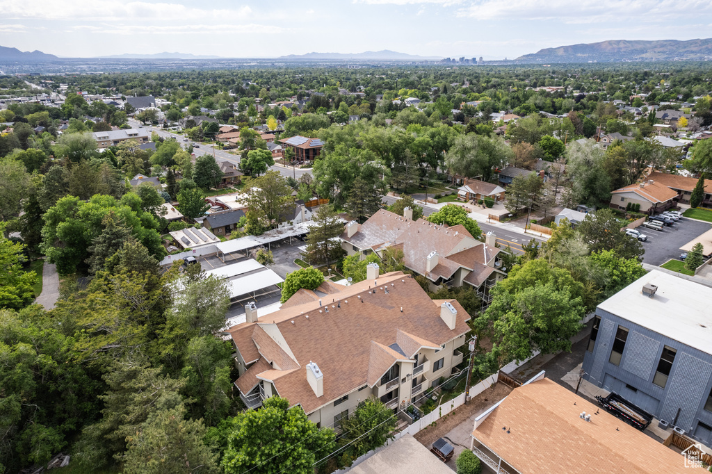 Aerial view of residential area featuring a mountainous background