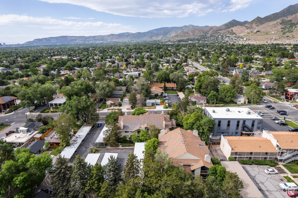Aerial view of residential area featuring a mountainous background