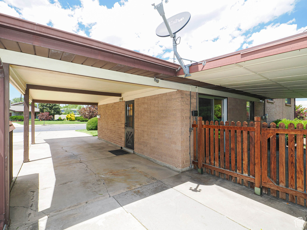 View of patio / terrace with a carport